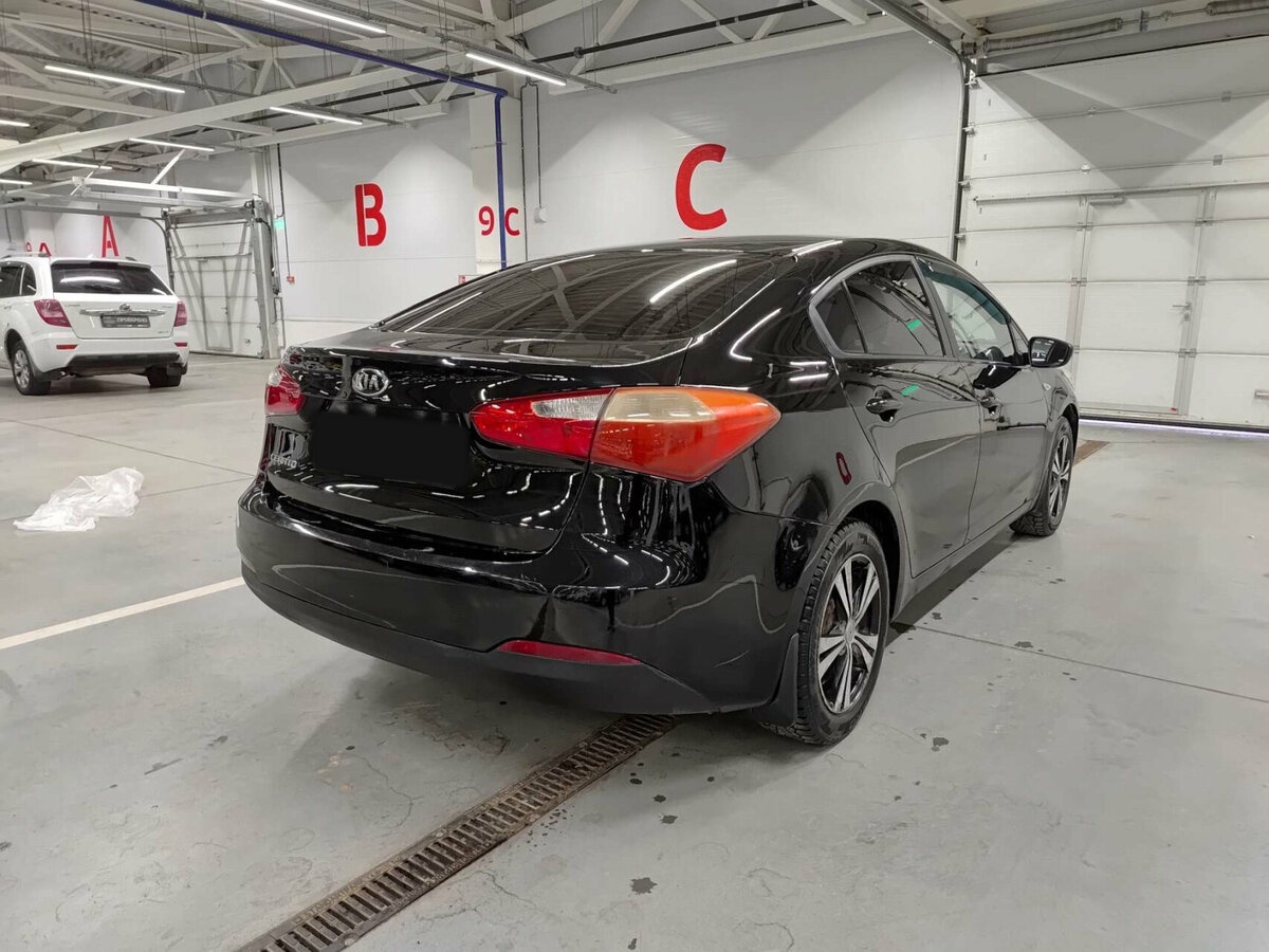 Kia Cerato с пробегом — 2013 год. Фото: #4