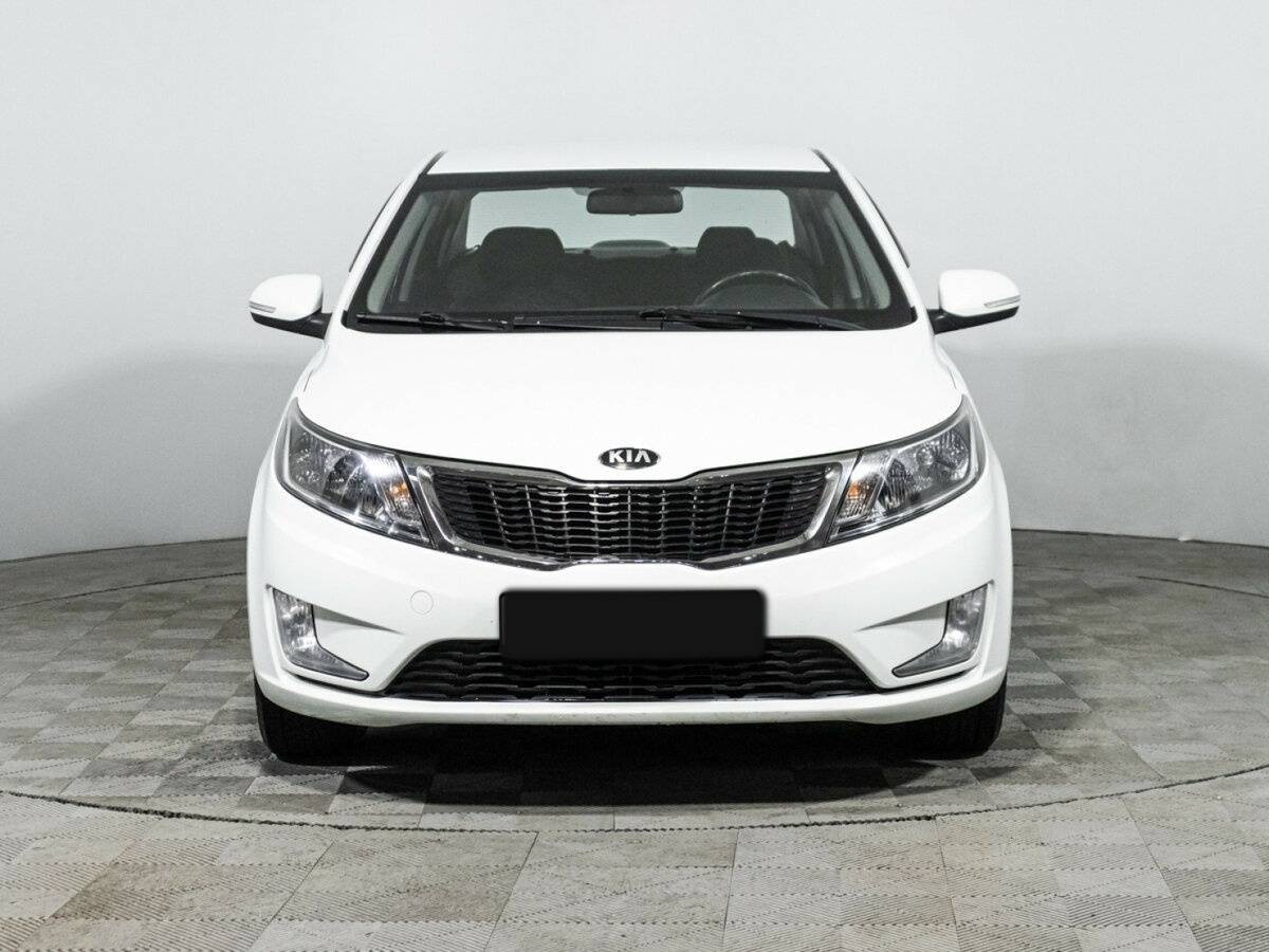 Kia Rio с пробегом — 2013 год. Фото: #1