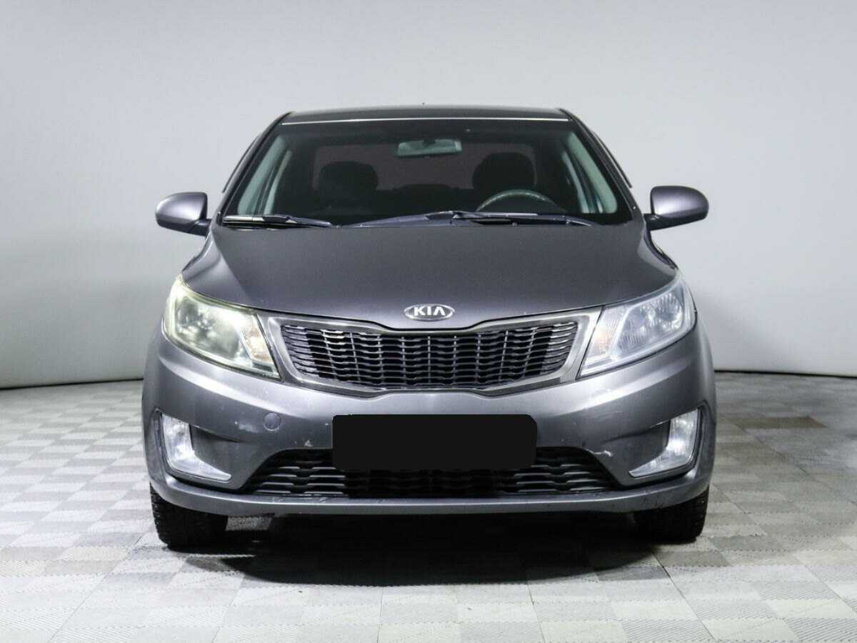 Kia Rio с пробегом — 2013 год. Фото: #1