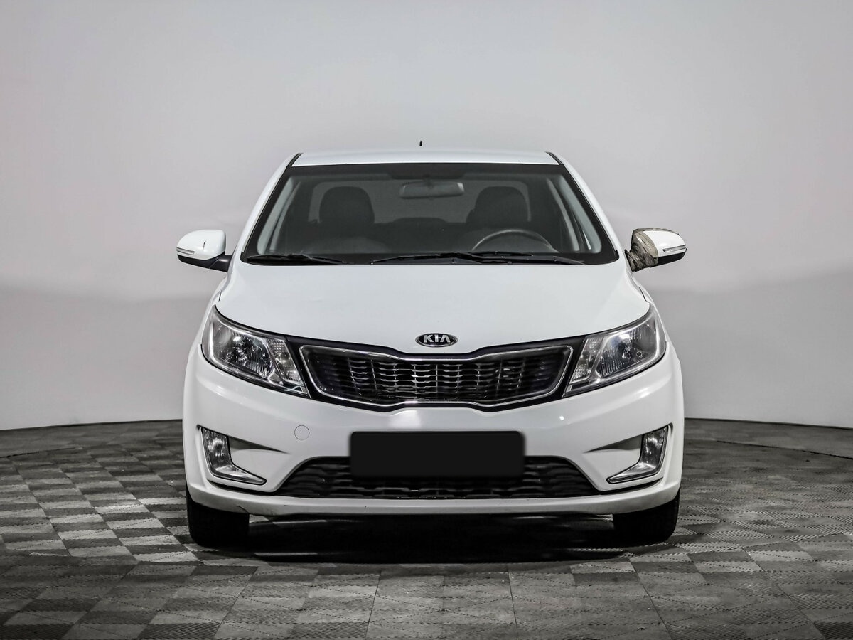 Kia Rio с пробегом — 2013 год. Фото: #1
