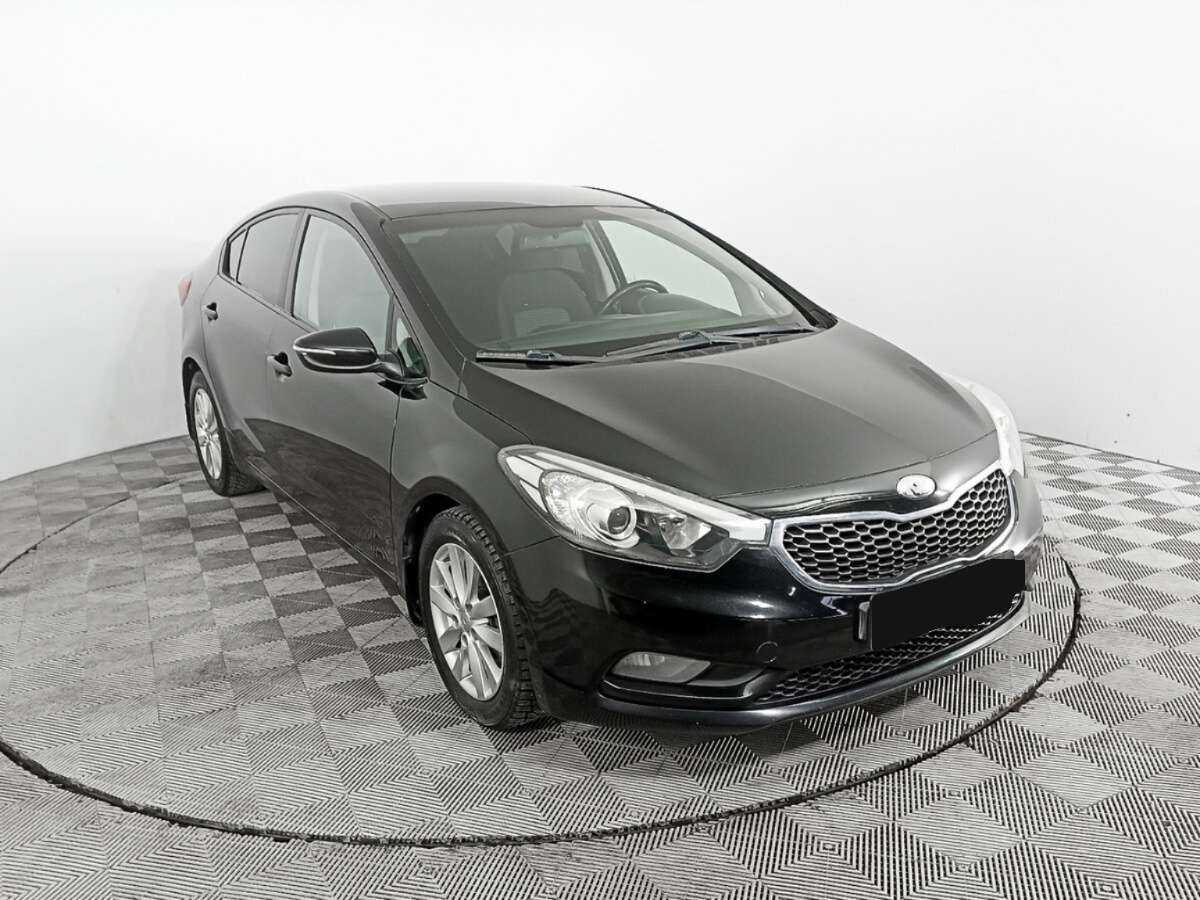 Kia Cerato с пробегом — 2013 год. Фото: #2