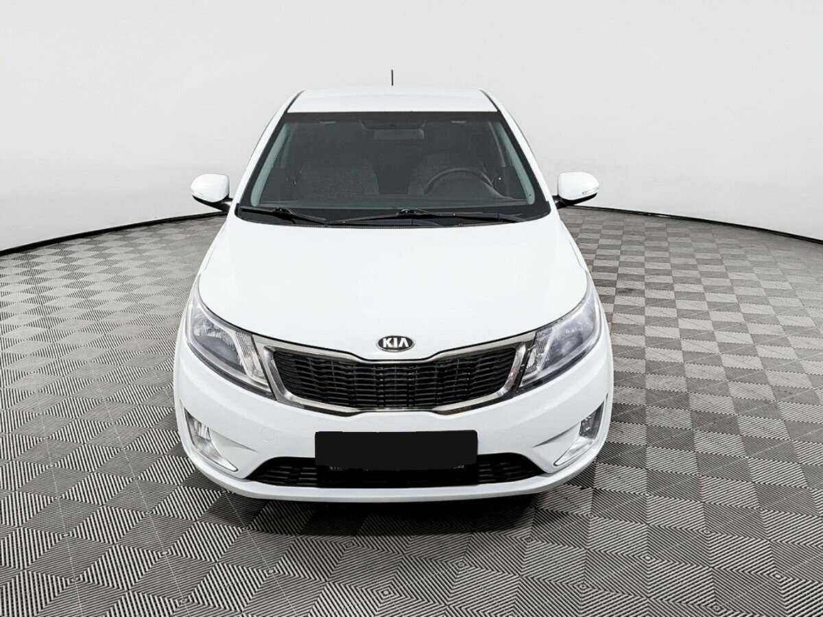 Kia Rio с пробегом — 2013 год. Фото: #1