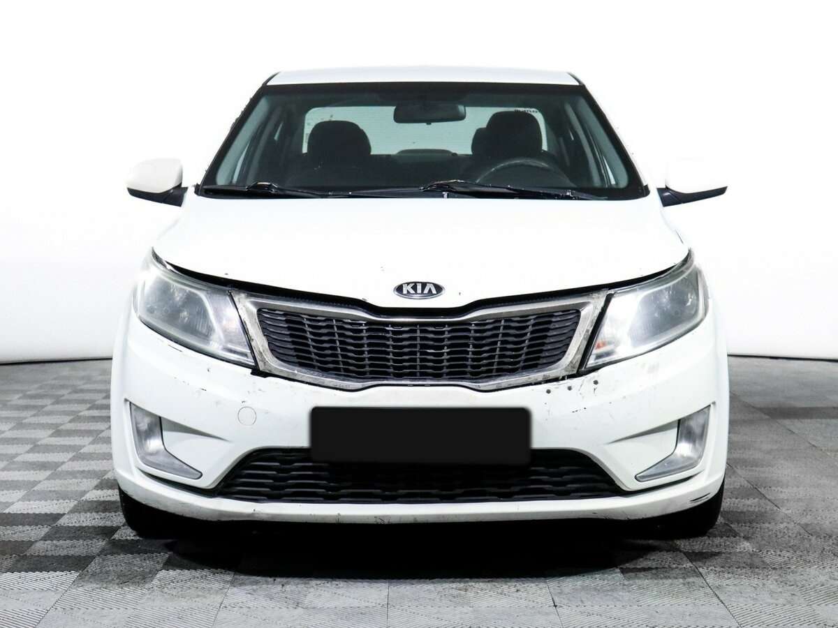Kia Rio с пробегом — 2013 год. Фото: #1